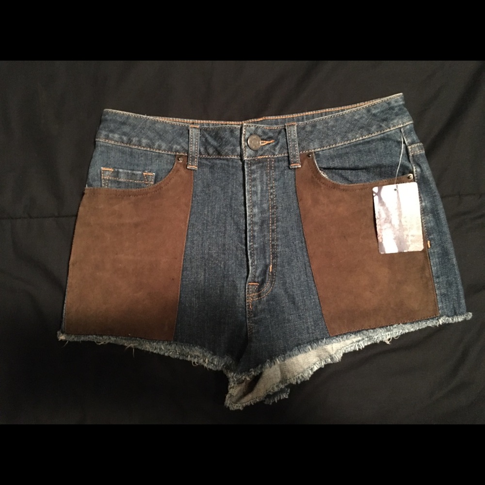 Vintage denim shorts with suede patches